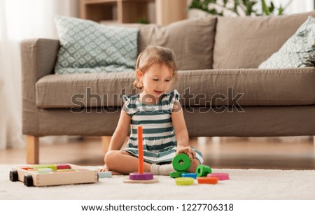 Similar – Image, Stock Photo Little girl playing in a home playground