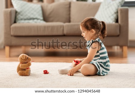 Similar – Image, Stock Photo Little girl playing in a home playground