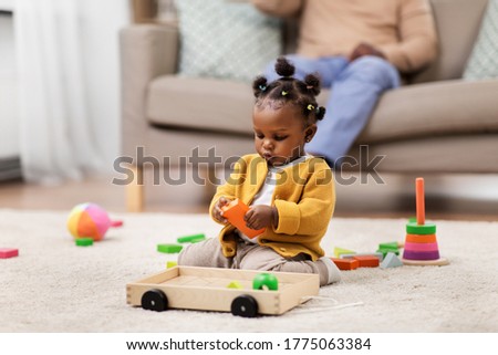 Similar – Image, Stock Photo Little girl playing in a home playground