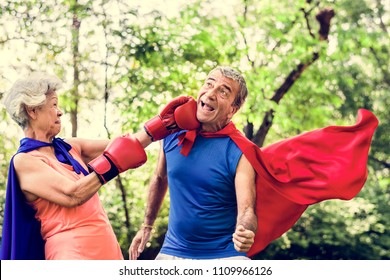 Childlike seniors wearing superhero costumes - Shutterstock ID 1109966126