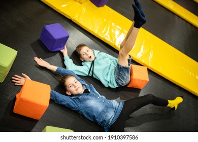 Children are active leisure. Sports weekend in sports center of acrobatics and trampoline. Physical education. Children having fun on trampoline in entertainment center, childhood and sporty lifestyle