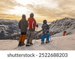 Children and adults, happy family in winter clothing at ski vacation, skiing, wintertime