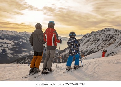 Children and adults, happy family in winter clothing at ski vacation, skiing, wintertime