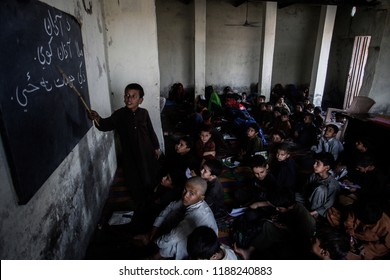 Children Of Afghan Refugees Attend A Class In Their School At An Afghan Refugee Camp In Lahore, Pakistan, October 23,2013