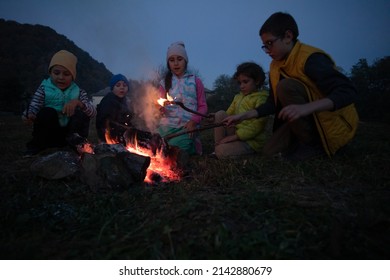 Children After Hiking Have A Picnic - Group Of Happy Friends