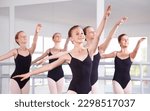 Children, ballet and dance with a group of girls dancing in a studio for theatre rehearsal or recital. Kids, ballerina and class with girl students learning about dancing together for performing arts