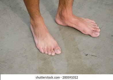 children barefoot on cement floor