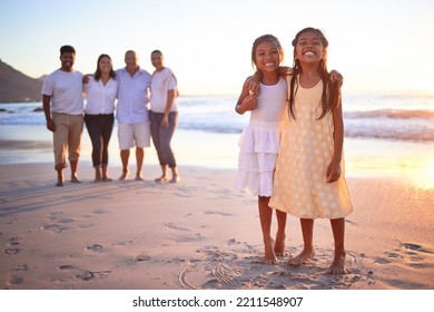 Children, Beach And Family With A Girl And Sister By The Ocean Or Sea At Sunset During Summer Vacation. Kids, Love And Travel With Daughter Siblings On Holiday With Their Parents And Grandparents