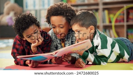 Children, book and reading on floor at school, learning and literacy knowledge or mind development. Boys, kids and storytelling for education, english and literature information on mat for language