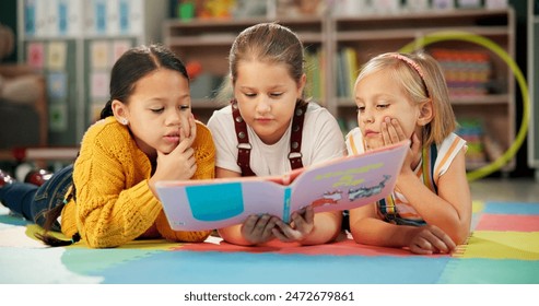 Children, book and reading together at school, learning and literacy knowledge or mind development. Girls, kids and storytelling for education, english and literature information on mat for language - Powered by Shutterstock