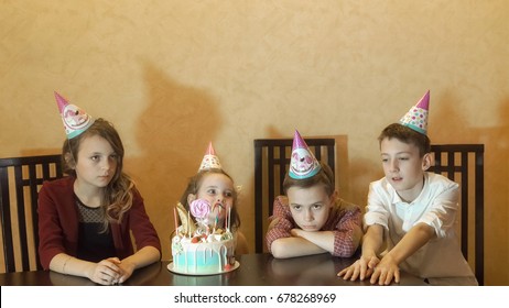 Children boring on birthday party. birthday cake for little birthday girl. - Powered by Shutterstock