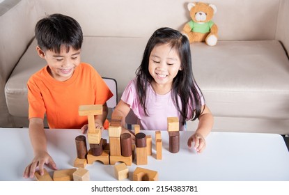 Children Boy And Girl Playing With Constructor Wooden Block Building, Happy Little Kids Play Wood Block Stacking Board Game At Home, Activities Learning Creative, Toys For Preschool And Kindergarten