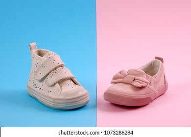 Children, Boy And Girl Shoes On Pink And Blue Background. Gender Stereotypes.