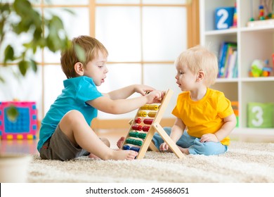 Children Boys Play With Abacus Toy Indoors