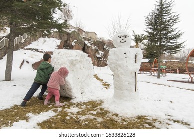 Children Build Snowman Kids Building Snow Stock Photo 1633826128 ...
