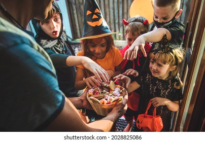 Children celebrate Halloween dressed up in costumes. Selective focus. Kids. - Shutterstock ID 2028825086