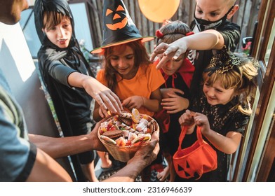 Children celebrate Halloween dressed up in costumes. Selective focus. Kids. - Powered by Shutterstock