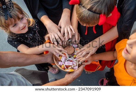 Children celebrate Halloween dressed up in costumes. Selective focus. Kids.