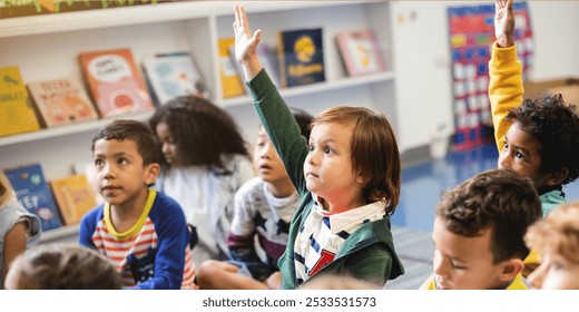 Children in a classroom raising hands. Diverse group of kids, including boys and girls, engaged in learning. Classroom setting with books and eager students. Little kids raising hands in classroom. - Powered by Shutterstock