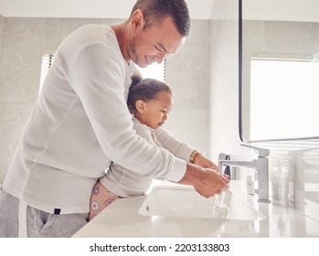 Children, Cleaning And Family With A Man And Girl Washing Their Hands In The Bathroom At Home Together. Kids, Water And Hygiene With A Father Teaching His Daughter About Clean And Healthy Living