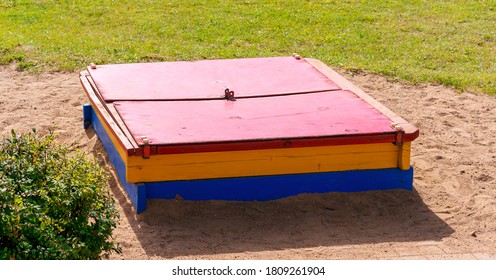 Children Closed Sandbox On Yellow Sand In Playschool Overhead View Outside