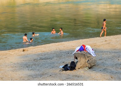 Children Clothes While Swimming At River Near Them School.