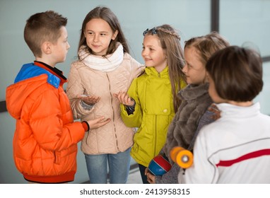 Children communicate in school yard in autumn - Powered by Shutterstock