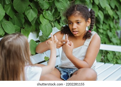 Children Communicate In Sign Language Sitting On A Bench On The Street, Learning, Hearing Loss,