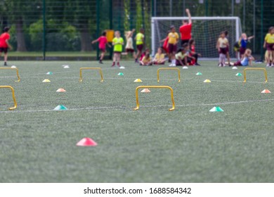 Children Competing During School Sports Day In The UK. Blurred Image With Selective Focus.