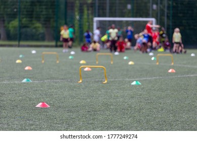 Children Competing During School Sports Day In The UK. Blurred Image With Selective Focus.