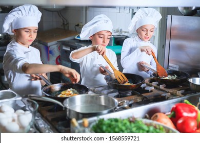 Children Cooking Lunch In A Restaurant Kitchen