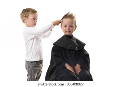 children cut each other's hair