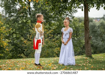 A children dancing couple dressed as characters from the novel War and Peace