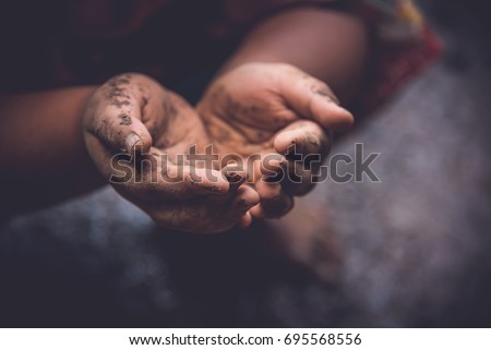 Children dirty open hand begging for money
