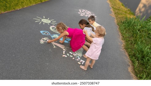 children draw a family with chalk. Selective focus. - Powered by Shutterstock