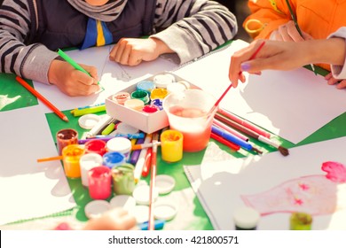 children draw with parents paint beautiful pictures, children's creativity - Shutterstock ID 421800571