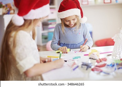 Children Drawing Some Christmas Paintings