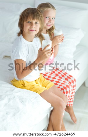 Similar – child girl playing checkers with her dad at home