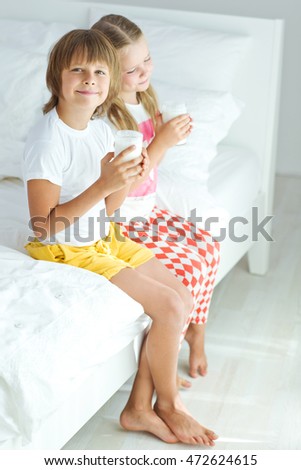 Similar – child girl playing checkers with her dad at home