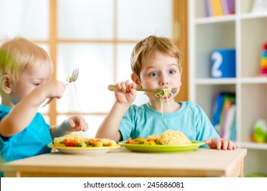 children eat healthy food in nursery or at home - Shutterstock ID 245686081