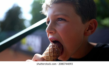 Children Eating Ice-cream Outside. Two Kids Eating Chocolate Icecream Cones