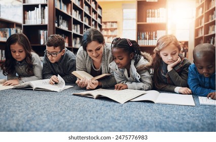 Children, education and teacher with books on library floor for reading, learning and teaching. Study, school and woman with kids for storytelling, help and fantasy, language and skill development - Powered by Shutterstock