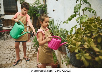 Children engaged in outdoor gardening, watering plants with bright watering cans. A delightful scene of kids learning about nature in a garden setting. - Powered by Shutterstock