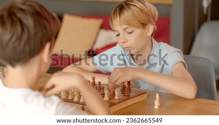 Children Engaging in Chess at School Competitions. Boy navigates intricacies of game. Move is decision fraught with consequences, requiring to foresee consequences choices, consider tactics opponents.