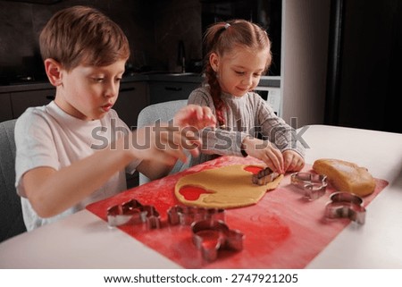 Children are enthusiastically preparing Easter cookies
