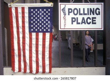 Children at the entrance to a polling place, CA