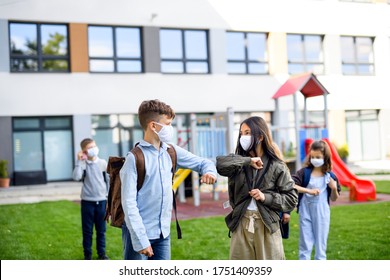 Children with face mask going back to school after covid-19 lockdown, greeting.