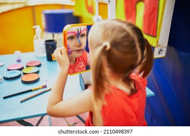 Children Face Painting. Artist Painting Little Preschooler Girl Like Butterfly. Creative Activities For Kids