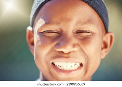 Children, Face And Teeth With A Black Boy Outside With A Big Smile And Eyes Closed. Kids, Head And Joy With A Carefree Little Male Child Standing Outdoors Alone With Flare And A Positive Expression