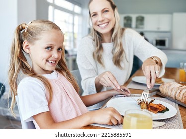 Children, Family And Food With A Girl And Mother Eating A Meal At The Dining Room Table At Home Together. Kids, Lunch And Love With A Woman And Daughter Sharing A Roast In Celebration Of An Event